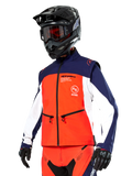 Alpinestars Lite-Dura Softshell Jacket in Navy, Hot Orange, and White, Motocross Gear, worn with black helmet and goggles, protective gloves, and matching racing pants