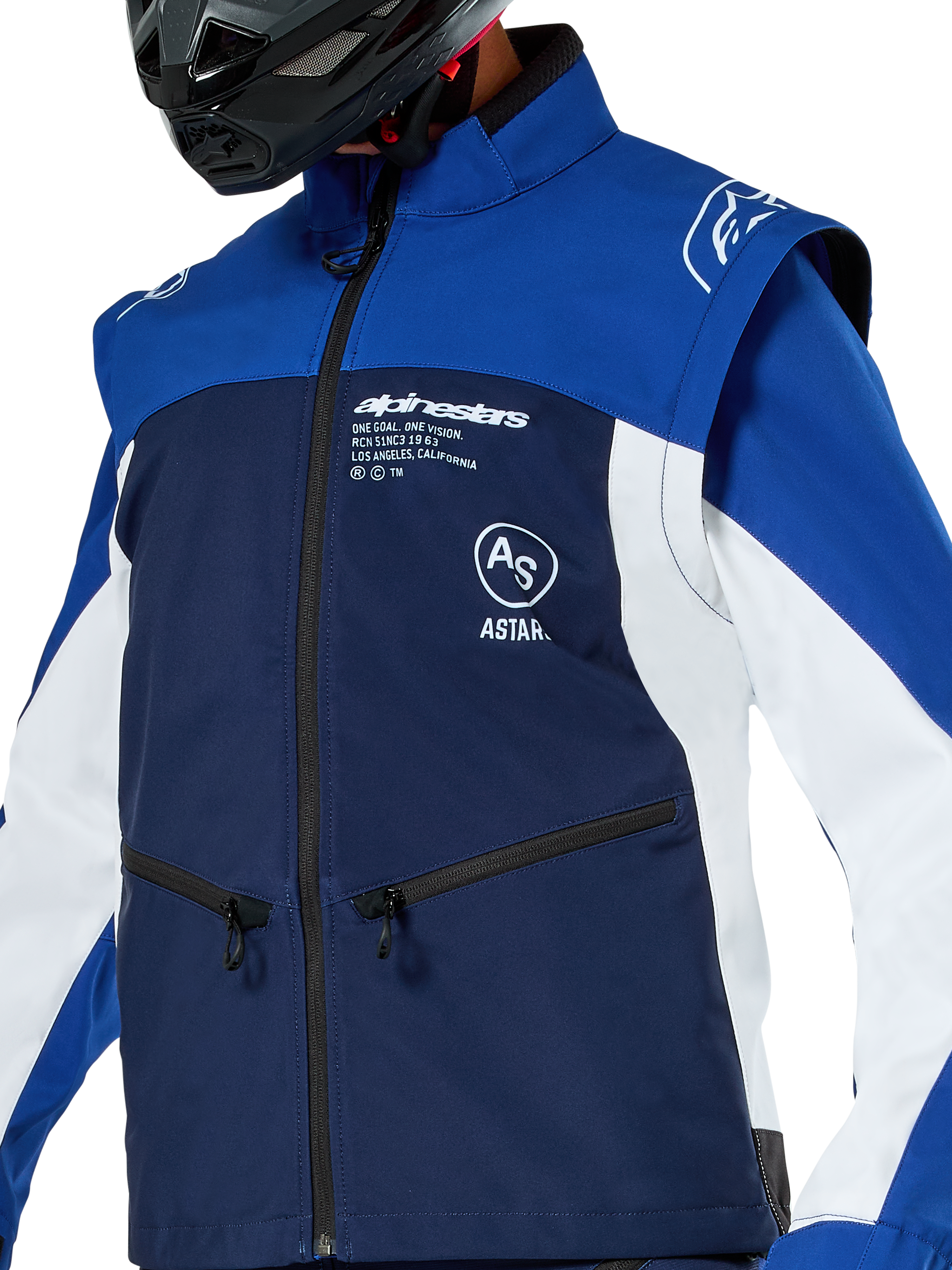 Alpinestars Lite-Dura Softshell Jacket, Motocross and Enduro Jacket, Navy Bright Blue and White, featuring white Alpinestars branding on the chest and zippered pockets, worn with a black helmet, durable softshell construction with detachable sleeves for off-road riding.