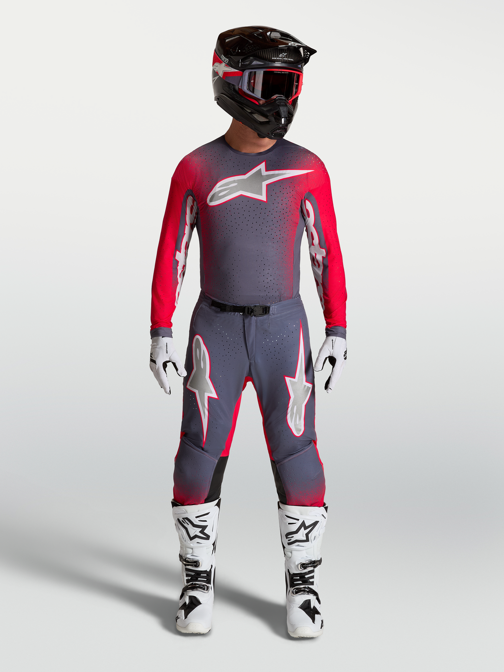 Alpinestars Supertech Hiten AFD Gear Set and Pants, professional motocross outfit in graystone and red fluo.