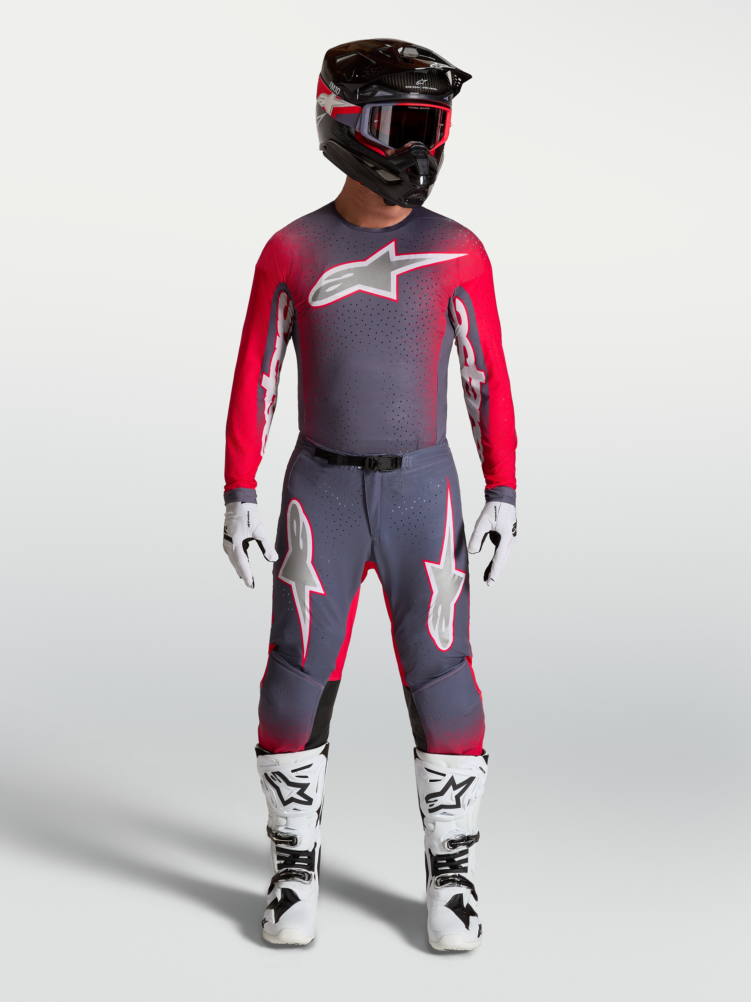 Alpinestars Supertech Hiten AFD Gear Set and Pants, professional motocross outfit in graystone and red fluo.