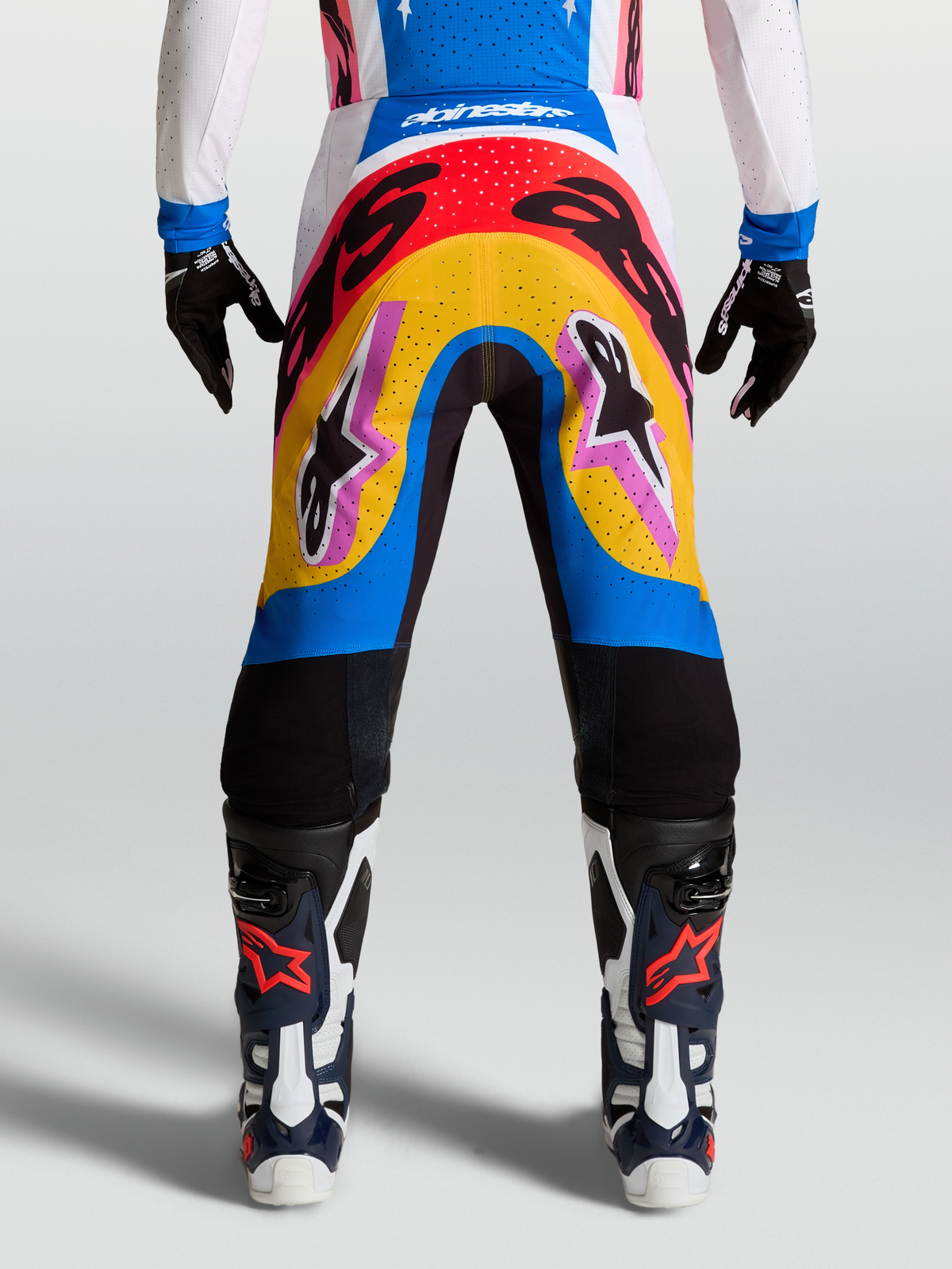Alpinestars Supertech Dyna Pants, Motocross Racing Pants, Blue and Yellow multi-color design, lightweight stretch rip-stop material on-model.