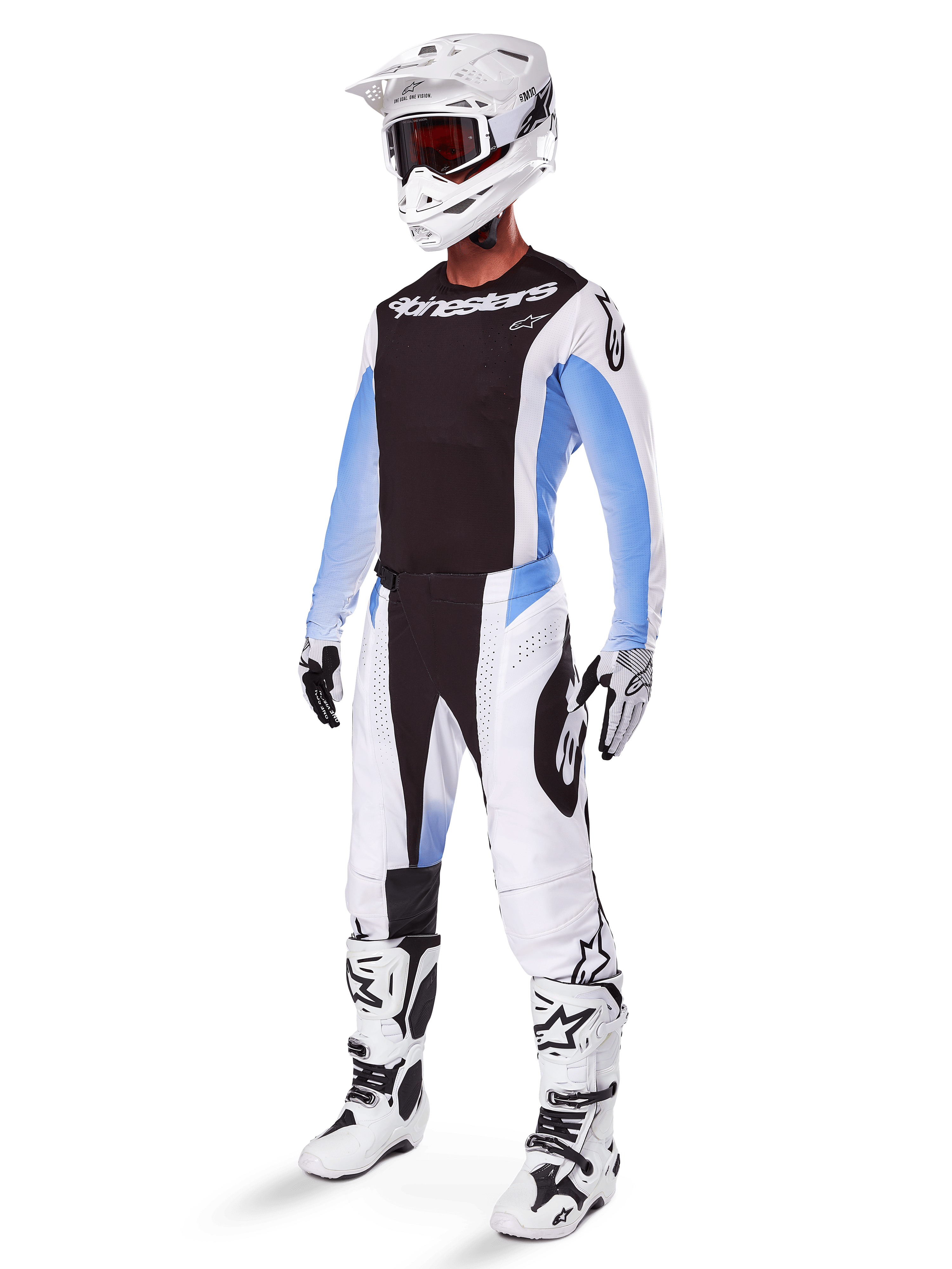 Motocross rider wearing Alpinestars 2025 Techstar Melt Pants, white and black motocross gear with light blue accents, coordinated jersey and gloves, white helmet and goggles, white and black racing boots, professional off-road kit.