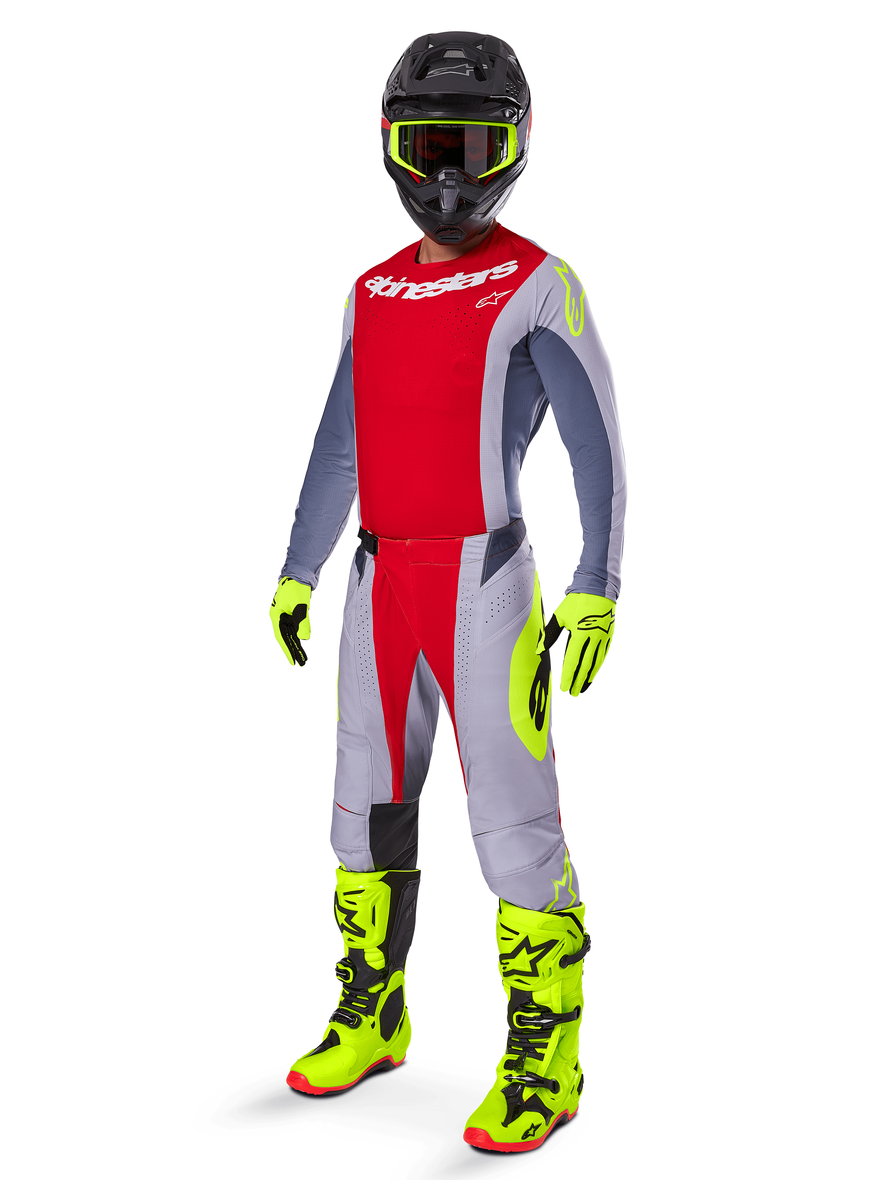 Motocrosskører iført Alpinestars 2025 Techstar Melt Gear Set, rød og grå trøje og bukser, neongule handsker og støvler, sort hjelm, komplet off-road racingudstyr