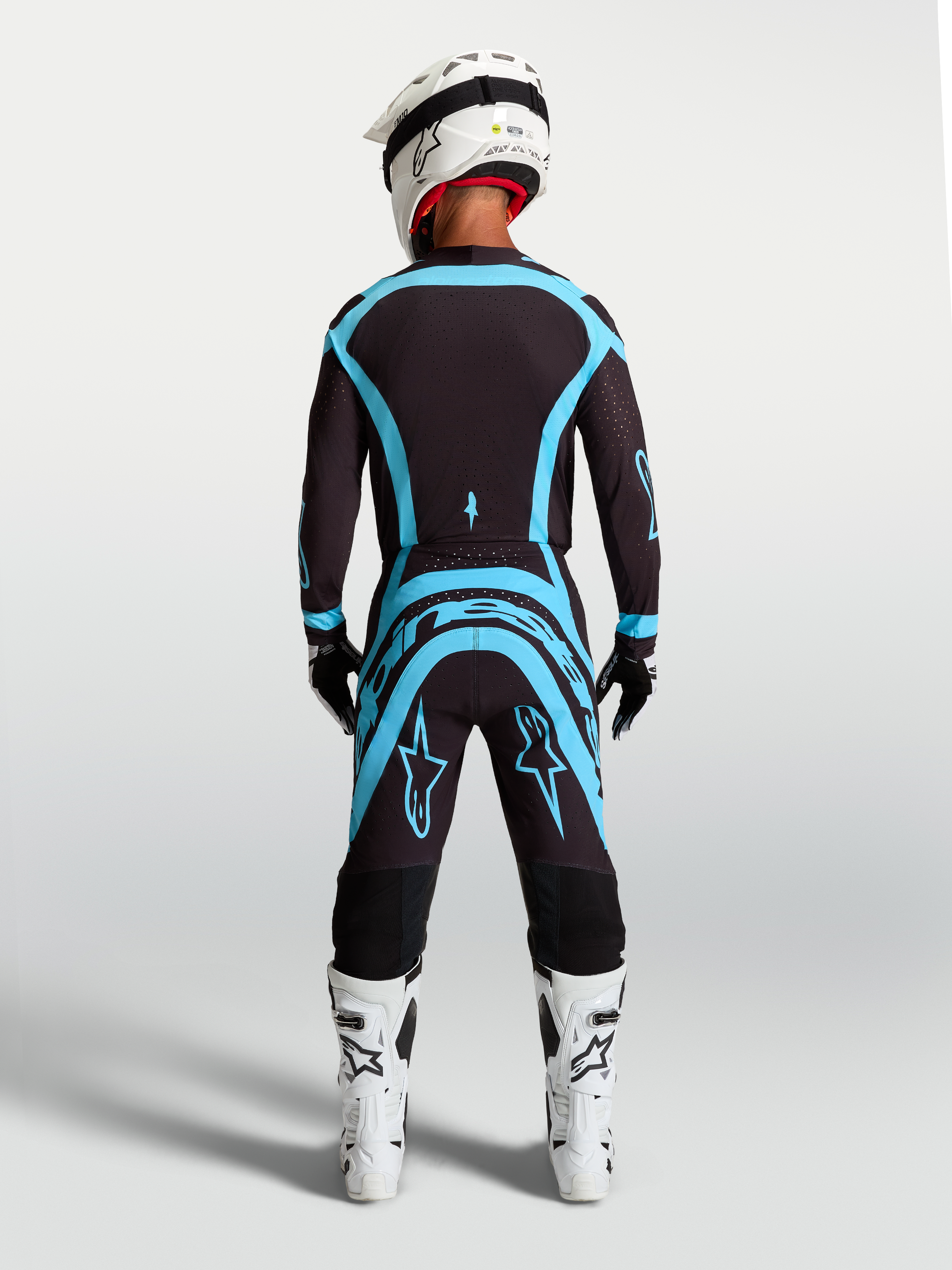 Alpinestars Supertech Vesta Pants in Black and Turquoise, pro-level motocross gear with an athletic performance fit.