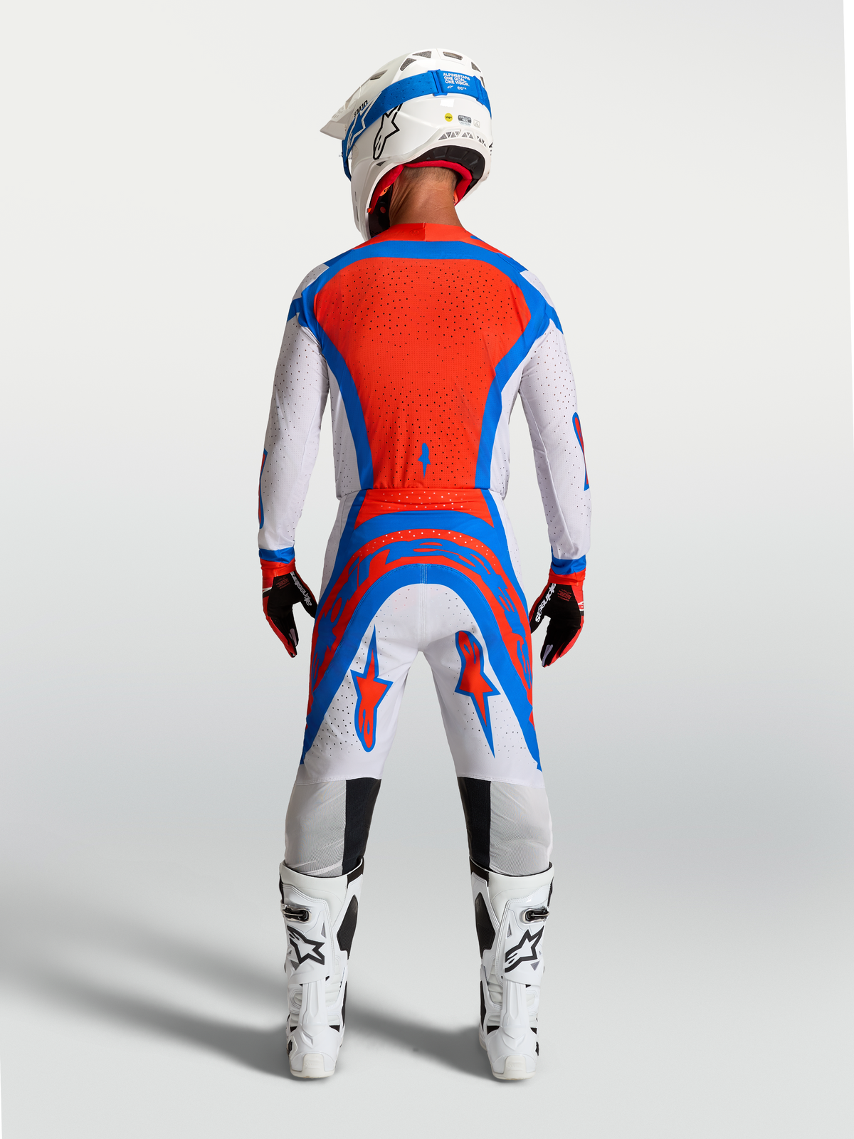 Alpinestars Supertech Vesta Motocross Pants in light lilac and red, on-model rear view showing athletic race fit.