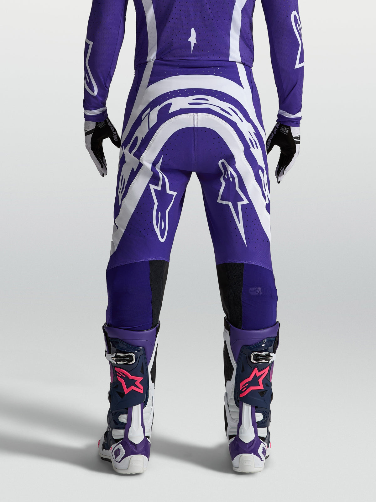 Alpinestars Men's Supertech Vesta Motocross Pants, Deep Blue and White, rear view showing athletic fit and rip-stop fabric.