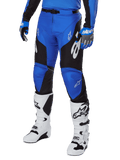 Alpinestars 2025 Racer Veil Pants, Motocross Pants, Blue and Black, with white graphic accents, worn with matching blue jersey, gloves, and white boots, durable protection gear for off-road racing