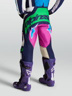 Alpinestars Techstar Maven Pants, Blue and Green motocross gear, rear view on model with Tech 10 boots.