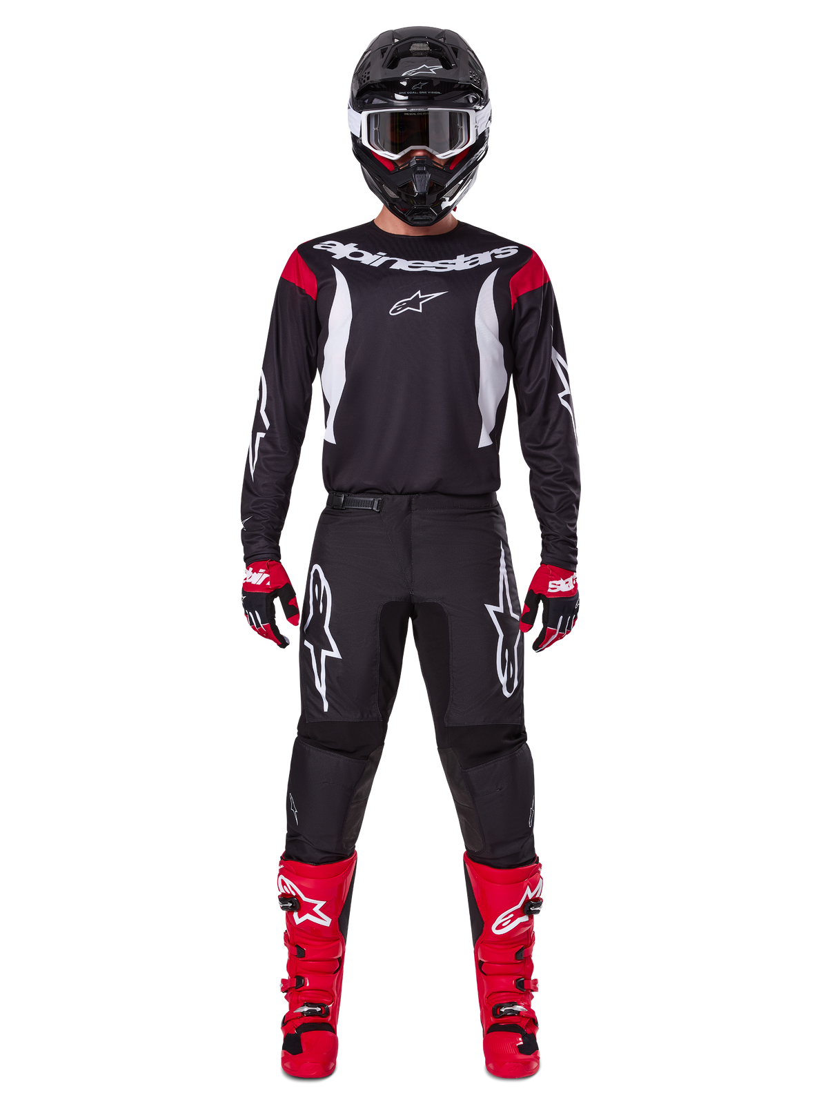 Alpinestars 2025 Fluid Haul-udstyrssæt, motocross-kører i komplet racerudstyr, sort jersey med røde skulderdetaljer og hvide logoer, sorte bukser med hvidt stjerne-branding, klare røde støvler, røde og sorte handsker, sort hjelm med hvide beskyttelsesbriller, koordineret off-road performance-look