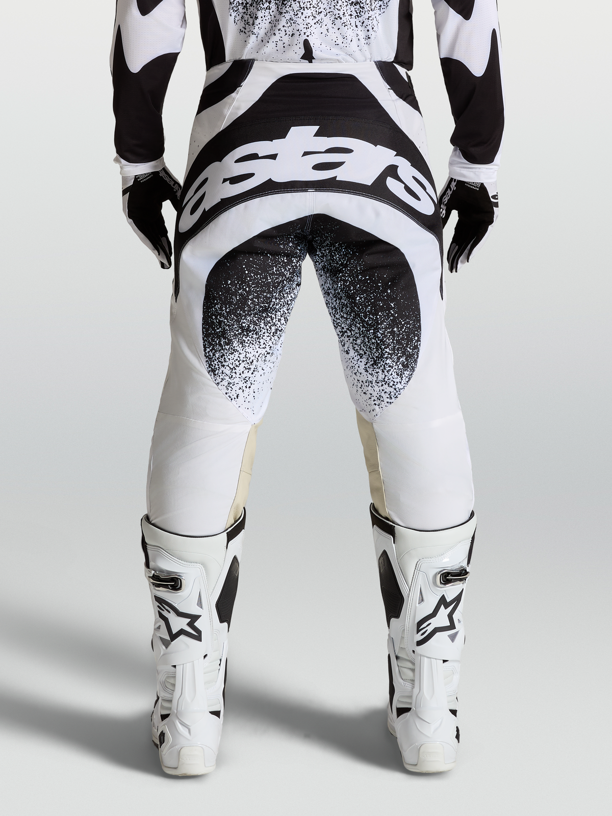 Alpinestars Techstar Swan Pants, professional motocross racing pants in black and white with rear logo graphics and Babel knee construction.