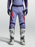 Alpinestars Racer Air Hunt Motocross Pants in light violet and deep purple with pink fluo accents, worn with white boots.