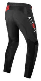 Alpinestars Supertech Foster bukser, motocrossbukser, sort med hvid lodret ASTARS-branding og røde stjernelogoer, højtydende tekstilkonstruktion med mesh-paneler for ventilation og bevægelsesfrihed
