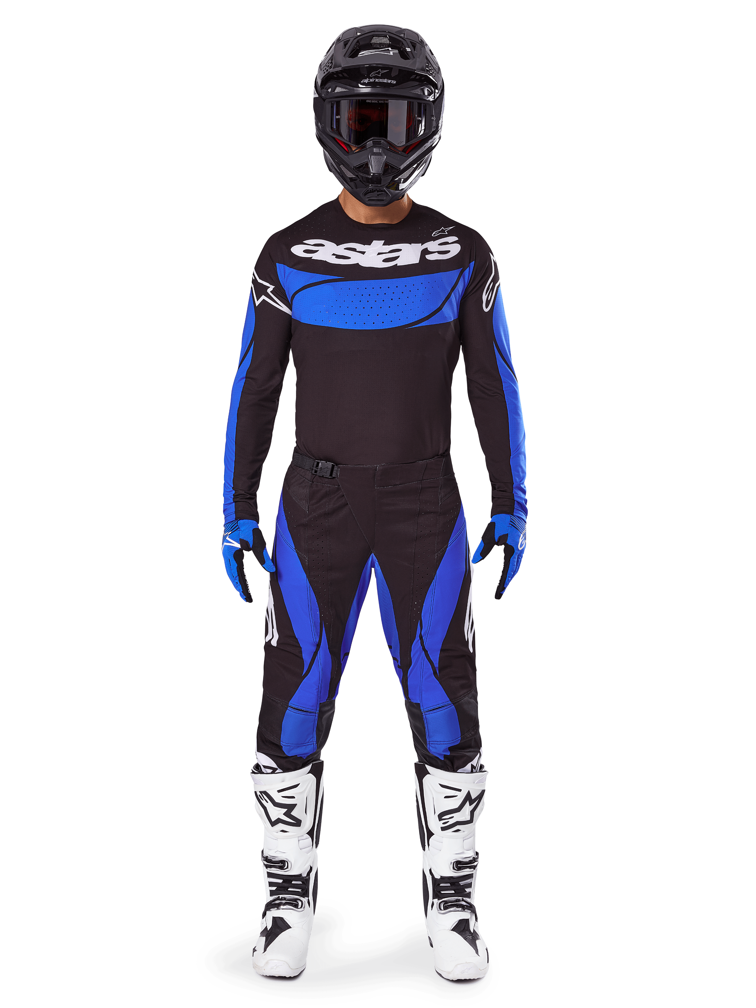 Motocross rider wearing the Alpinestars 2025 Techstar Dreem Gear Set, black jersey with blue chest panel and sleeves, matching black and blue pants, black helmet with goggles, and white boots, complete coordinated motocross outfit for off-road racing.