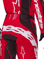 Alpinestars 2025 Techstar Dreem bukser, motocross-bukser, klar rød og sort, nærbillede af bagside og talje med hvid branding, sorte strækpaneler og tekniske detaljer på linningen, designet til off-road racing