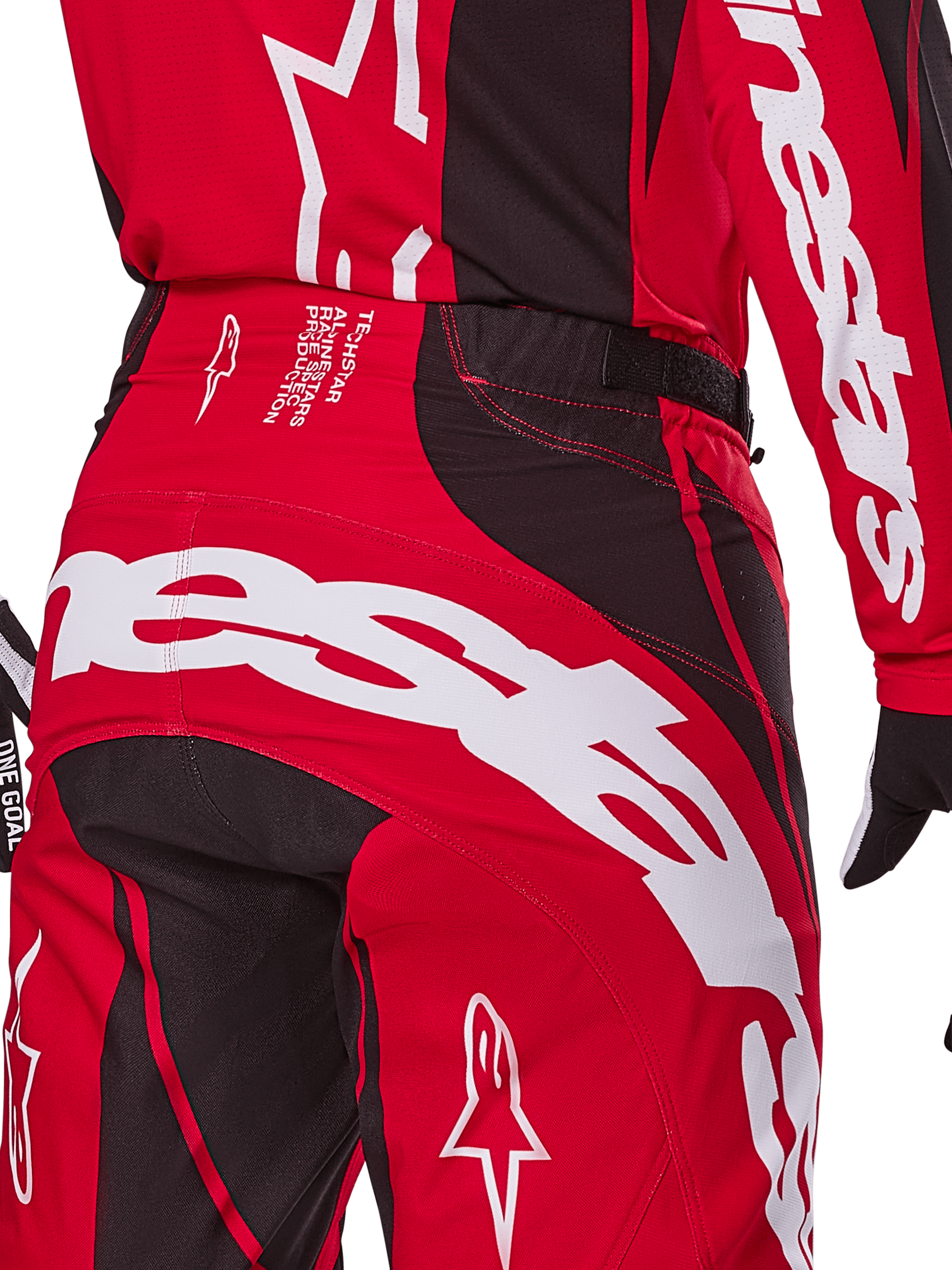 Alpinestars 2025 Techstar Dreem bukser, motocross-bukser, klar rød og sort, nærbillede af bagside og talje med hvid branding, sorte strækpaneler og tekniske detaljer på linningen, designet til off-road racing
