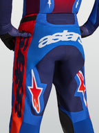 Alpinestars Racer Hunt Bukser, herre-motocrossbukser i blå og rød med hvid astars-branding og stjernegrafik bagpå.
