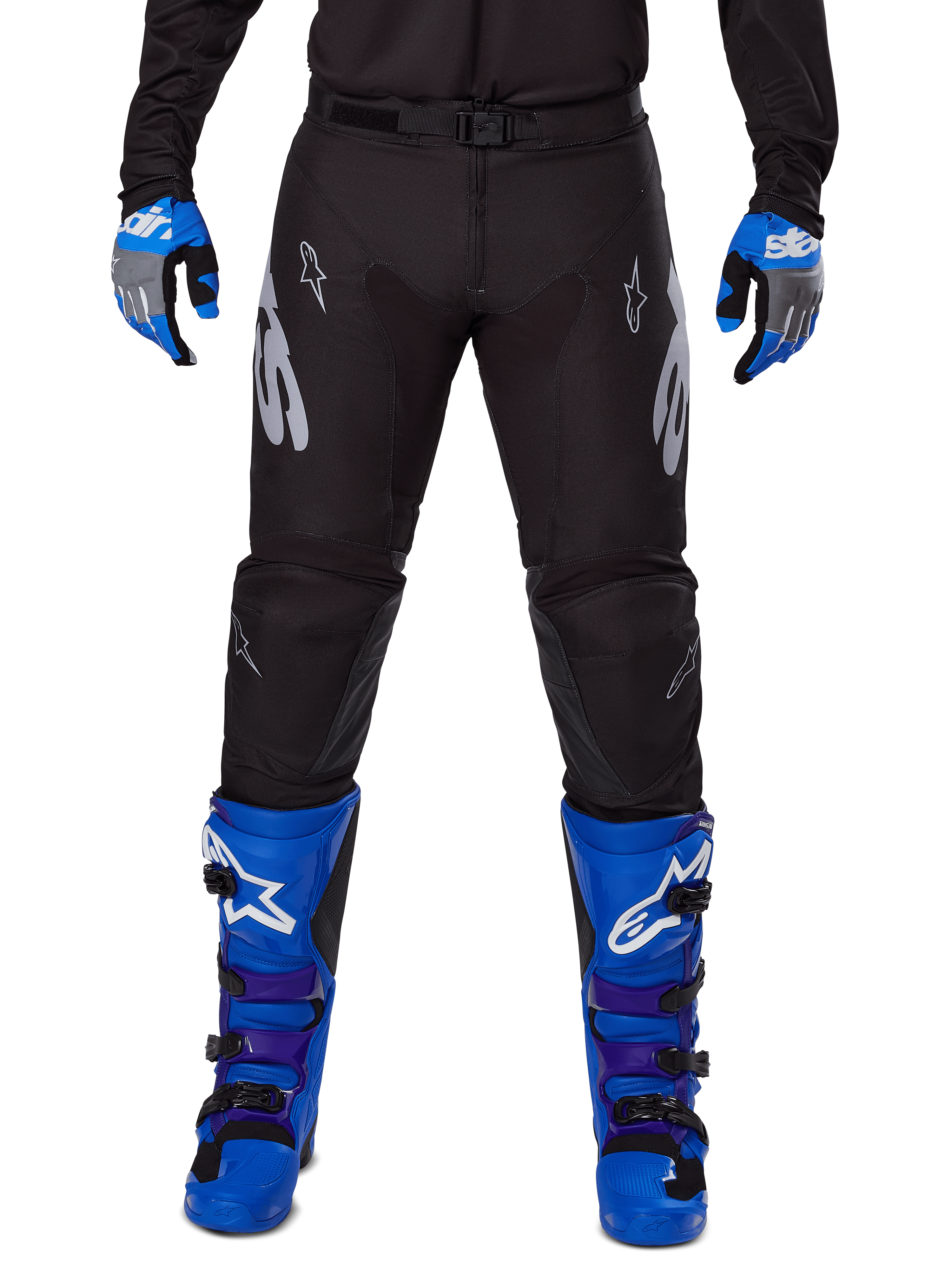 Alpinestars 2025 Racer Graphite Pants, Motocross Pants, Black and Gray, worn with blue and gray gloves and blue boots, featuring silver Astars branding on the thighs and reinforced knees, sporty design for off-road performance
