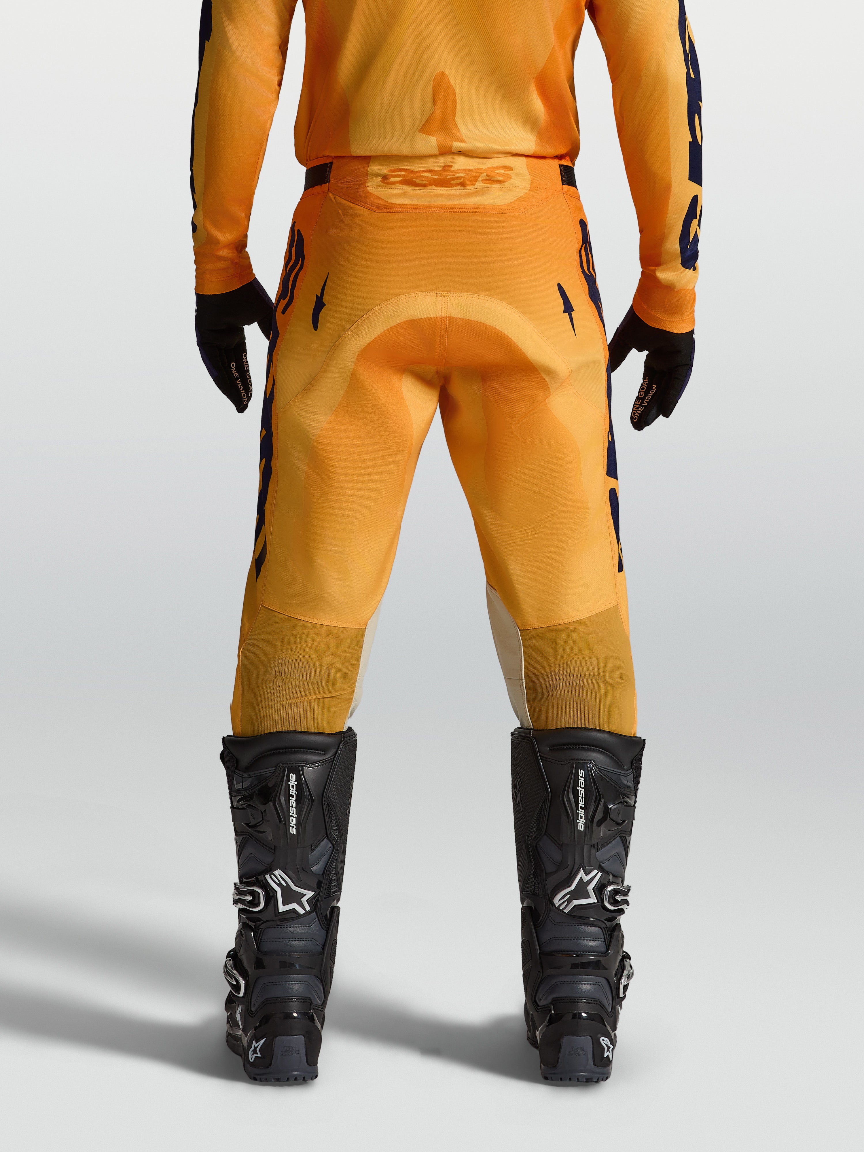 Alpinestars Racer Amber bukser, orange og mørkeblå motocrossbukser til herrer, set bagfra med forstærket sæde
