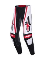 Alpinestars 2026 Techstar Nomur bukser, motocross-bukser, sort, hvid og rød, med store røde Astars-logoer på lårene, hvide paneler med lodrette røde striber og "astars"-branding på knæene.