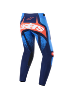 Alpinestars 2026 Techstar Nomur bukser, motocross-bukser, mørkeblå, orange og UCLA-blå, set bagfra med et markant hvidt astars-logo på et orange panel, multi-panel design med lyseblå detaljer, sorte indvendige knæpaneler, slidstærkt udstyr til off-road racing.