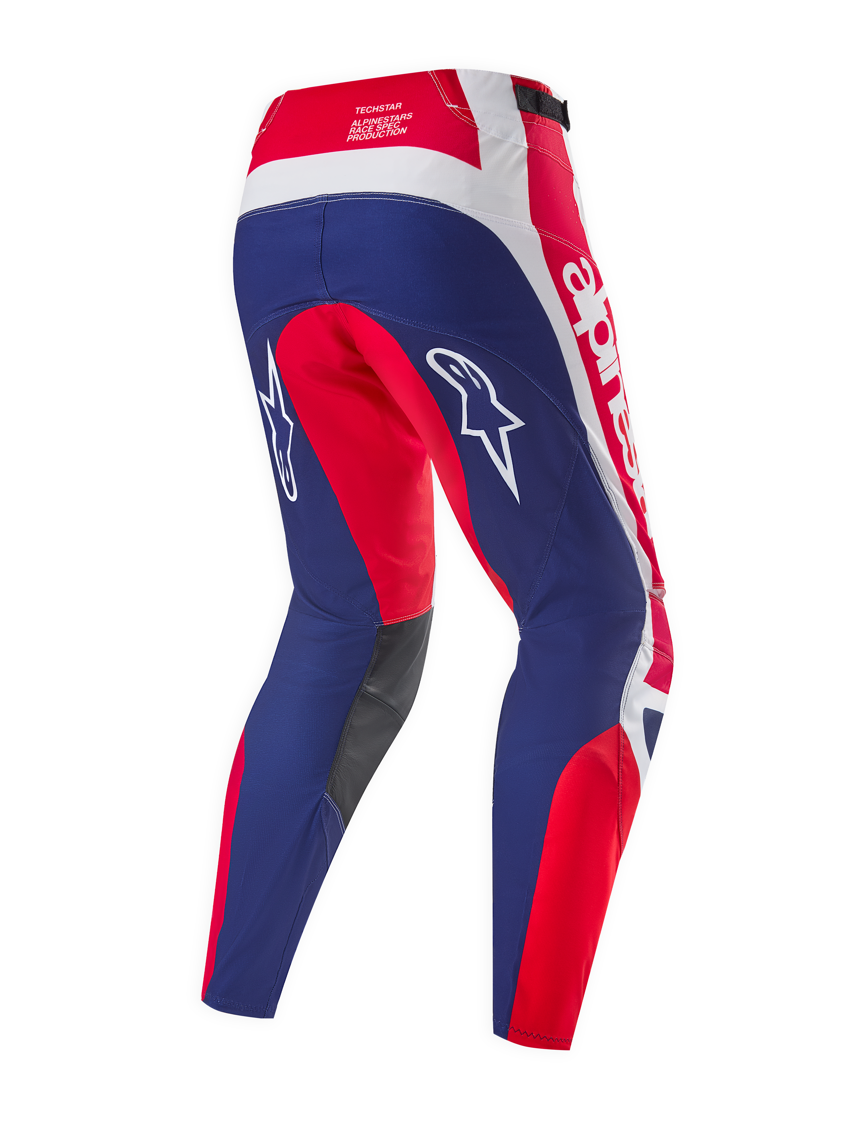 Alpinestars Limited Edition Techstar Fortitude bukser, motocross-bukser, rød, hvid og blå, set bagfra med fokus på ergonomiske racerpaneler, hvide Alpinestars-logoer, mørkegrå indvendige knæpaneler
