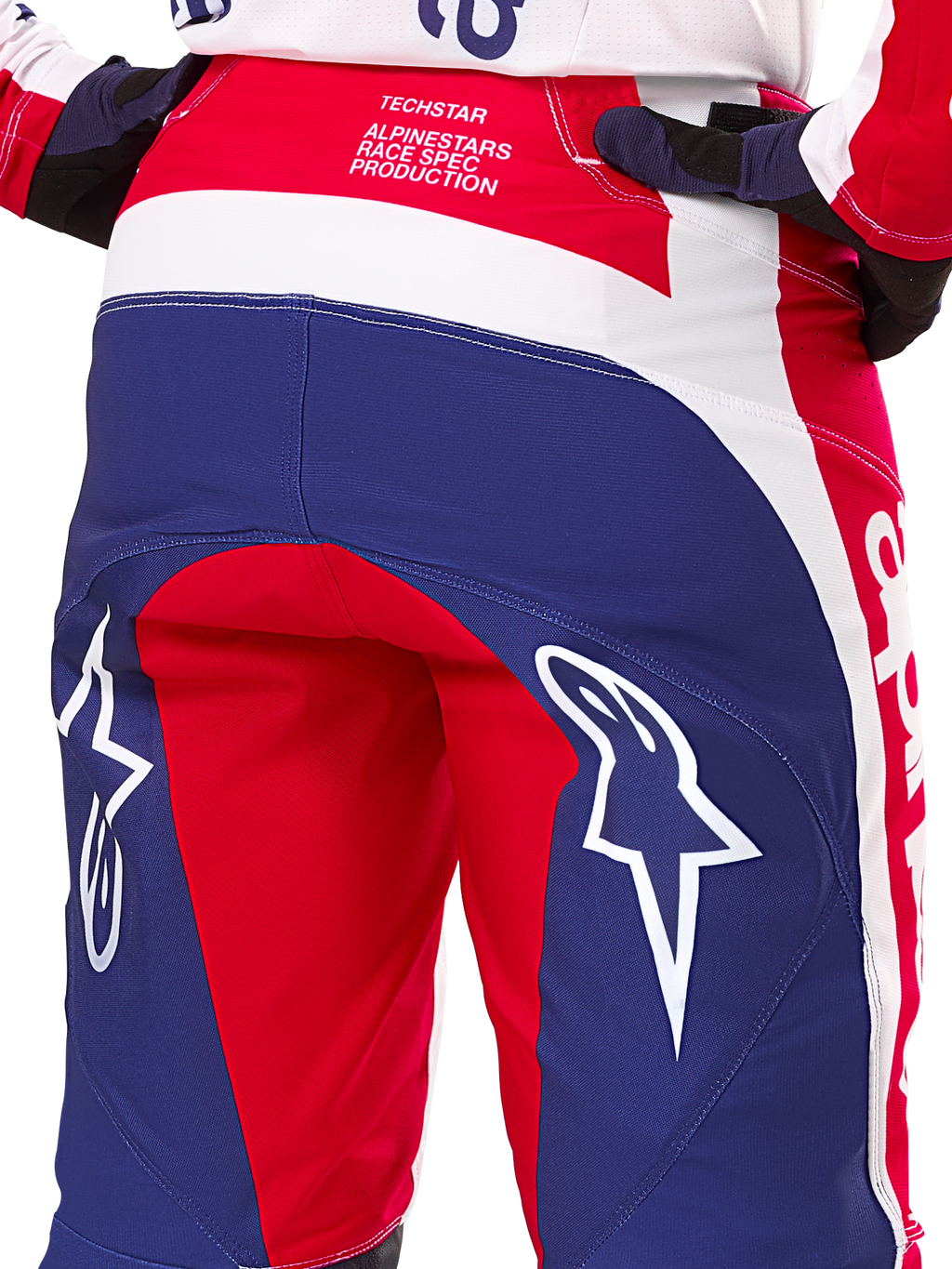 Alpinestars Limited Edition Techstar Fortitude bukser, motocrossbukser, rød, hvid og blå, set bagfra med store hvide stjernelogoer på bagdelen og Techstar Race Spec-branding, slidstærke performance-tekstiler til off-road racing