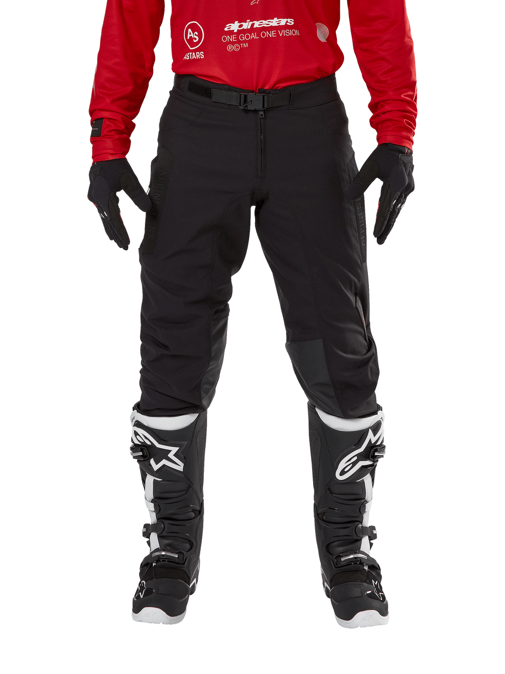 Alpinestars Techdura Pants, Enduro and Off-Road Pants, Black, worn with a red Alpinestars jersey and black and white boots, featuring rugged stretch canvas construction, adjustable magnetic belt buckle, and leather knee reinforcements for off-road performance.