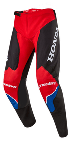 Alpinestars Honda Racer Iconic bukser, motocross-bukser, rød, sort og hvid med blå detaljer, stort hvidt HONDA-logo på låret, Alpinestars-branding på knæene, ergonomisk forformet benkonstruktion og justerbar skraldelukning i taljen.