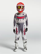 Alpinestars Supertech Swan bukser, motocross-racerudstyr til unge, grå og rød fluo, atletisk pasform.