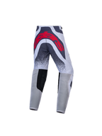 Alpinestars Supertech Swan motocrossbukser til ungdom i grå og rød, atletisk race-pasform med stort logo bagpå.