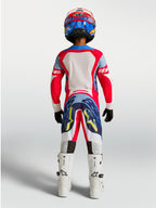 Alpinestars Youth Supertech Dyna Pants, red and navy blue motocross gear for young riders, rear view on-model.