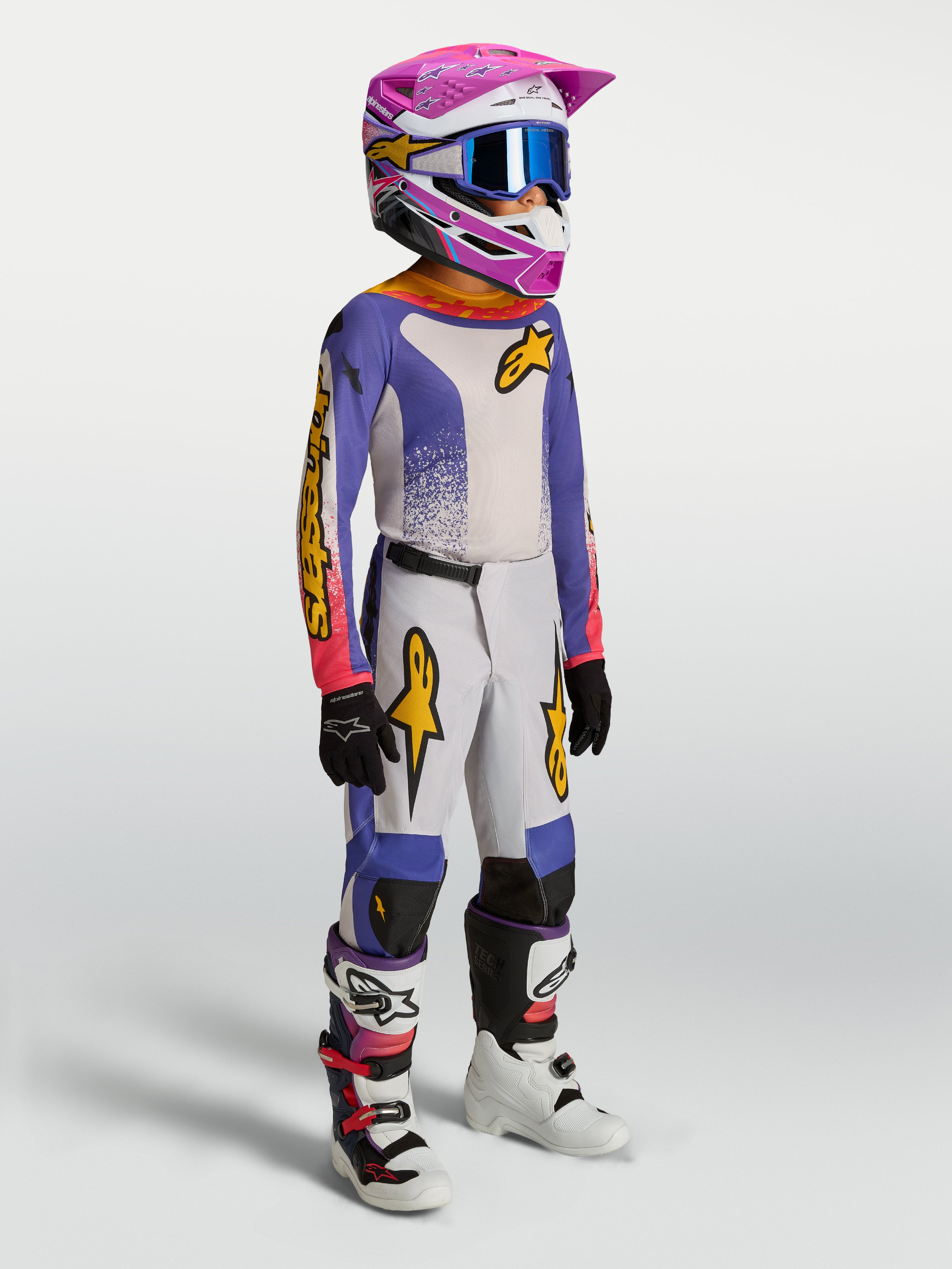 Alpinestars 2027 Fluid Drag bukser ungdom, motocrossudstyr i blå og guld, slidstærkt tekstil og ergonomisk pasform til off-road kørsel.