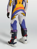 Alpinestars 2027 Fluid Drag bukser, motocrossbukser til ungdom, blå og hvid, holdbar 600D polyfabric, set bagfra.