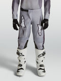 Alpinestars 2027 Fluid Amber bukser til ungdom, grå og sorte motocrossbukser, slidstærkt design til off-road kørsel.