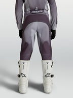Alpinestars Youth Fluid Amber Motocross Pants in gray and sand with reinforced seat and ergonomic stretch panels.
