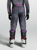 Alpinestars Youth Fluid Lone Pants for motocross, Gray Camo and Purple textile, rear view on model.