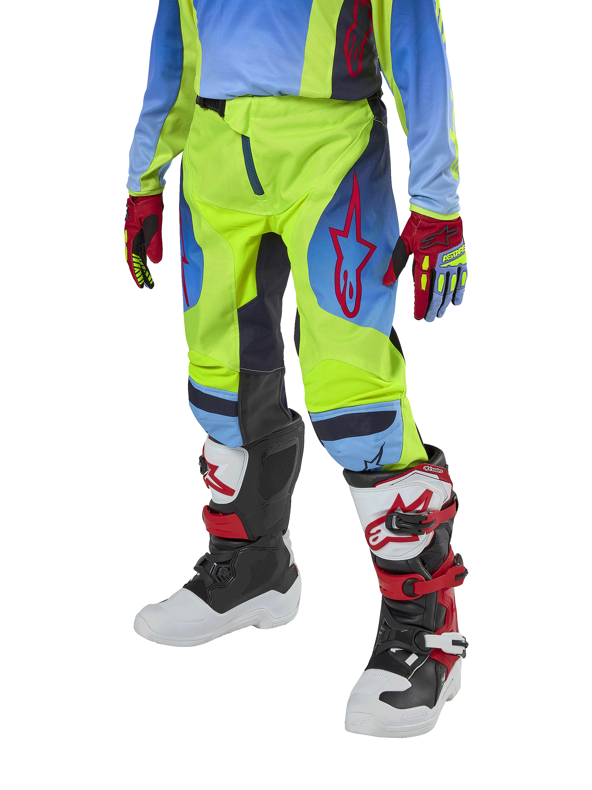 Alpinestars Youth 2024 Racer Hoen bukser, motocross-bukser til unge, neongul og mørkeblå med røde detaljer, båret med matchende handsker og hvide, sorte og røde støvler, med sportspasform og forbuede ben til terrænkørsel