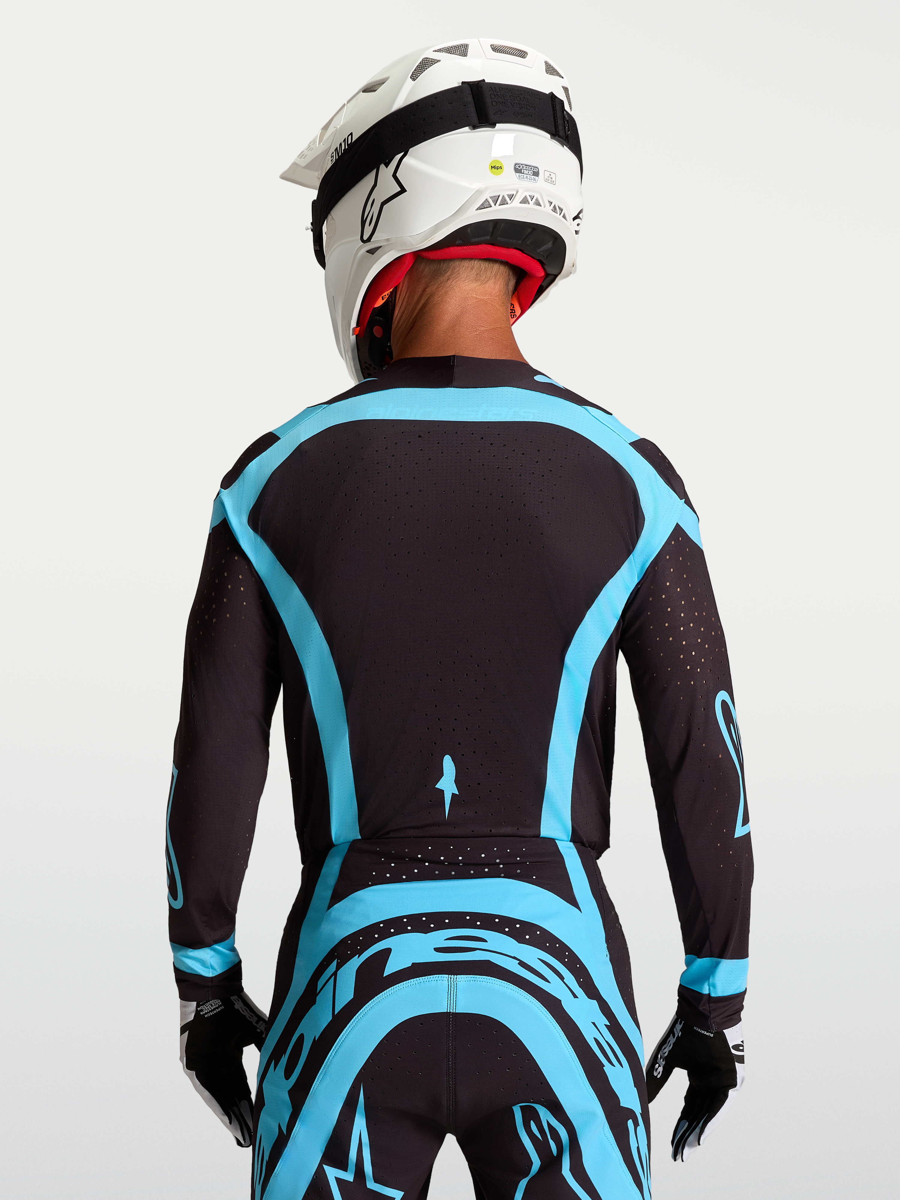 Alpinestars Supertech Vesta Jersey, black and turquoise pro-level motocross racing jersey with stretch mesh.