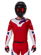 Alpinestars 2025 Racer Veil Jersey, Motocross Racing Jersey, Red White and Blue, Long Sleeve, worn with black helmet and orange goggles, matching red gloves and pants, sleek performance design for off-road riding