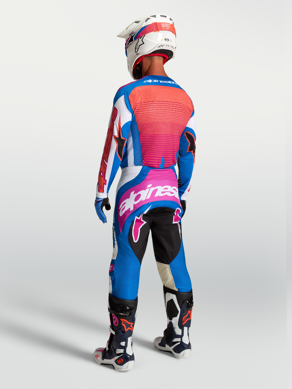 Alpinestars Techstar Maven Jersey and Techstar Maven Gear Set, blue and hot coral motocross gear, rear view.