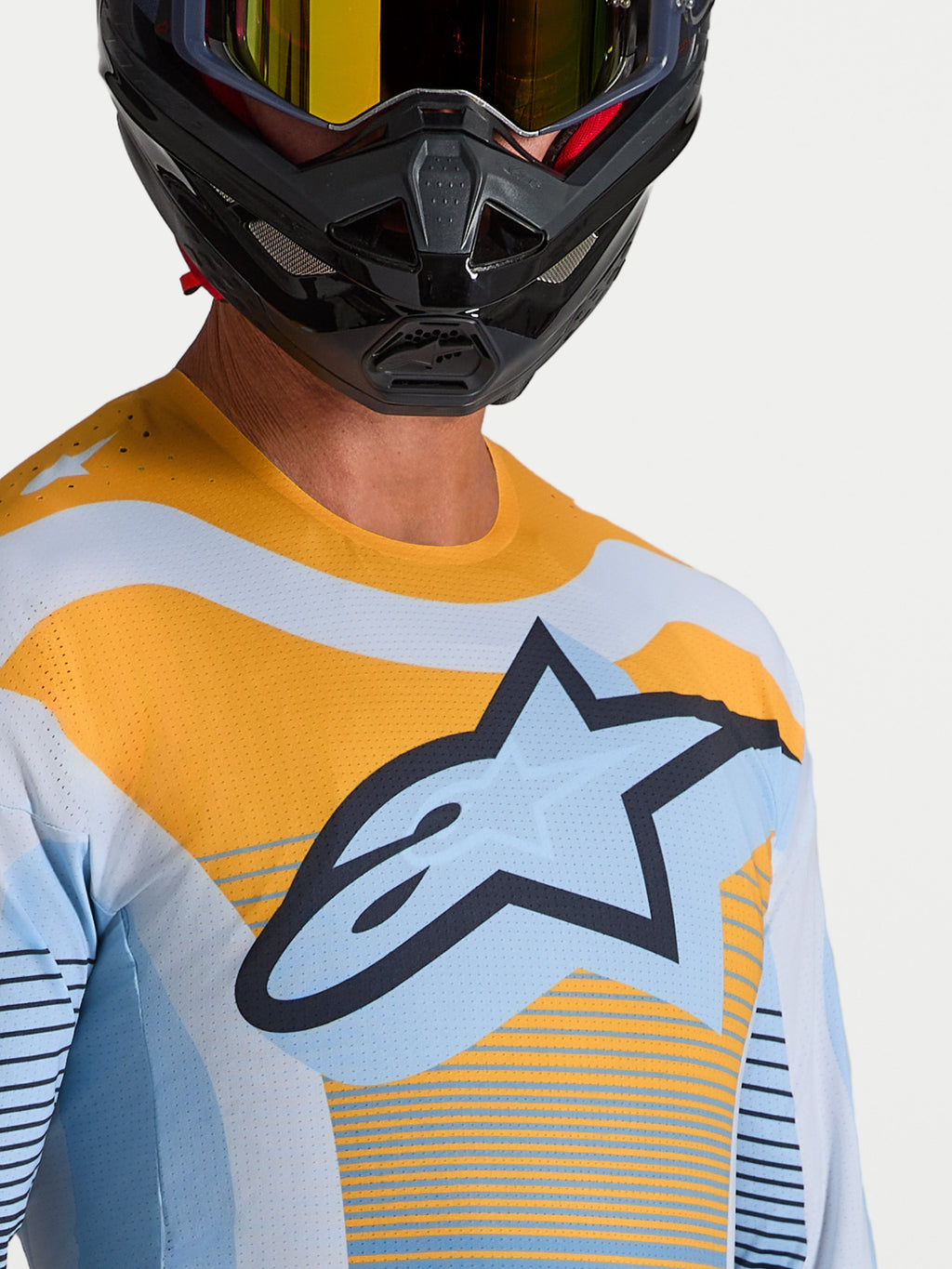 Alpinestars Techstar Maven trøje, blå og orange motocross-racer-top med laserskåret ventilation og atletisk pasform.