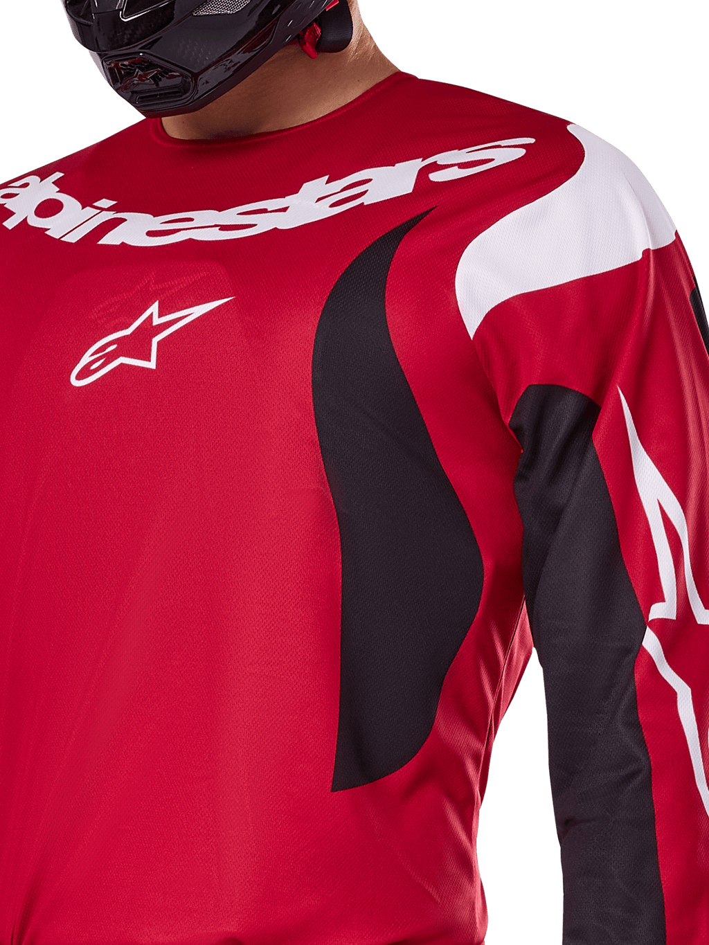 Alpinestars 2025 Fluid Haul Jersey, Bright Red and Black, close-up view of the chest and arm featuring white Alpinestars branding and logo, athletic ergonomic design with black and white swooping accents for motocross performance.