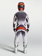 Alpinestars Techstar Swan Jersey and Gear Set, gray and white motocross gear with a red logo, rear on-model view.
