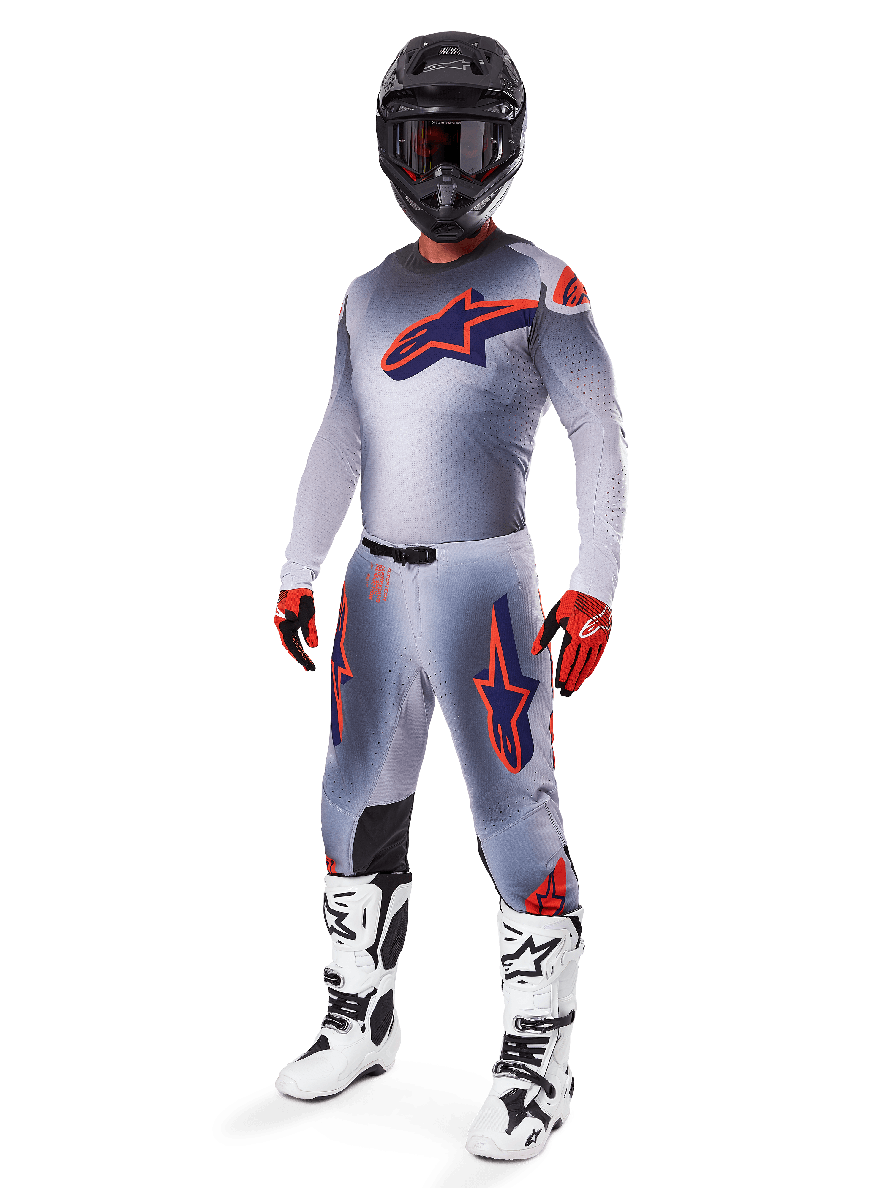 Alpinestars 2025 Supertech Lipan Gear Set, Motocross Racing Gear, Gray with Orange Fluo and Navy Blue star graphics, worn with a black helmet, red and black gloves, and white and black boots, complete professional off-road outfit with ventilated design