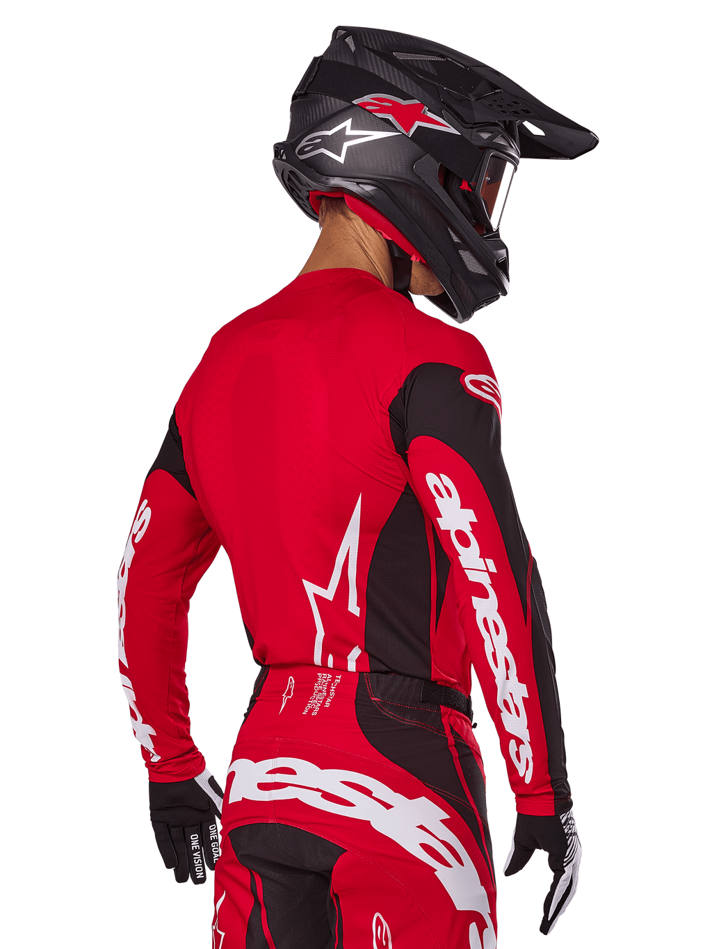 Alpinestars 2025 Techstar Dreem-udstyrssæt, motocross-kører set bagfra, rød og sort jersey med hvidt logo på ærmerne, matchende røde og sorte bukser med markant hvidt logo på bagdelen, sort carbonhjelm med røde detaljer, sort-hvide handsker, professionelt raceroutfit til terrænkørsel