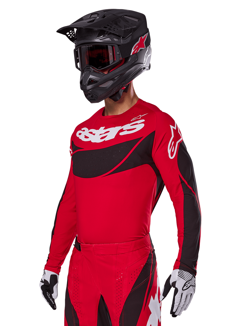 Alpinestars 2025 Techstar Dreem-udstyrssæt, rød motocross-jersey og bukser med sorte og hvide detaljer, her vist med sort hjelm og goggles, hvide og sorte handsker, med markant 'astars'-branding, designet til højtydende off-road-kørsel