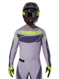 2025 Techstar Dreem jersey- og udstyrssæt, motocross-raceroutfit, lysegrå og mørkegrå med neongule detaljer, med 'astars'-branding, vist med sort hjelm, goggles og matchende handsker, teknisk perforeret materiale til off-road-brug