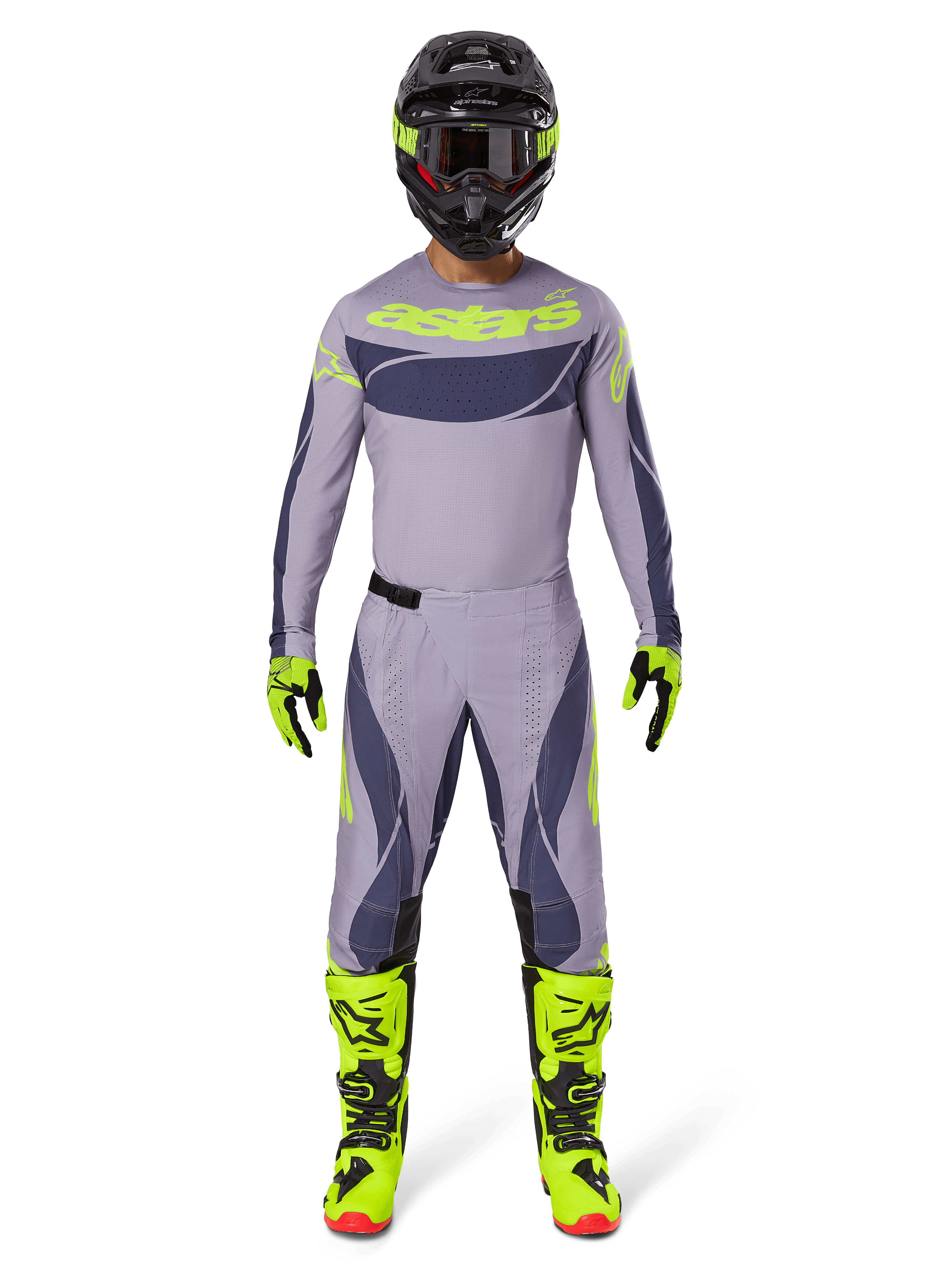 Motocross-rytter iført fuldt racerudstyr, 2025 Techstar Dreem trøje i grå og mørkegrå med neongul branding, matchende grå og mørkegrå bukser, neongule og sorte støvler, sort hjelm med neon-detaljer, koordineret outfit til professionel motocross