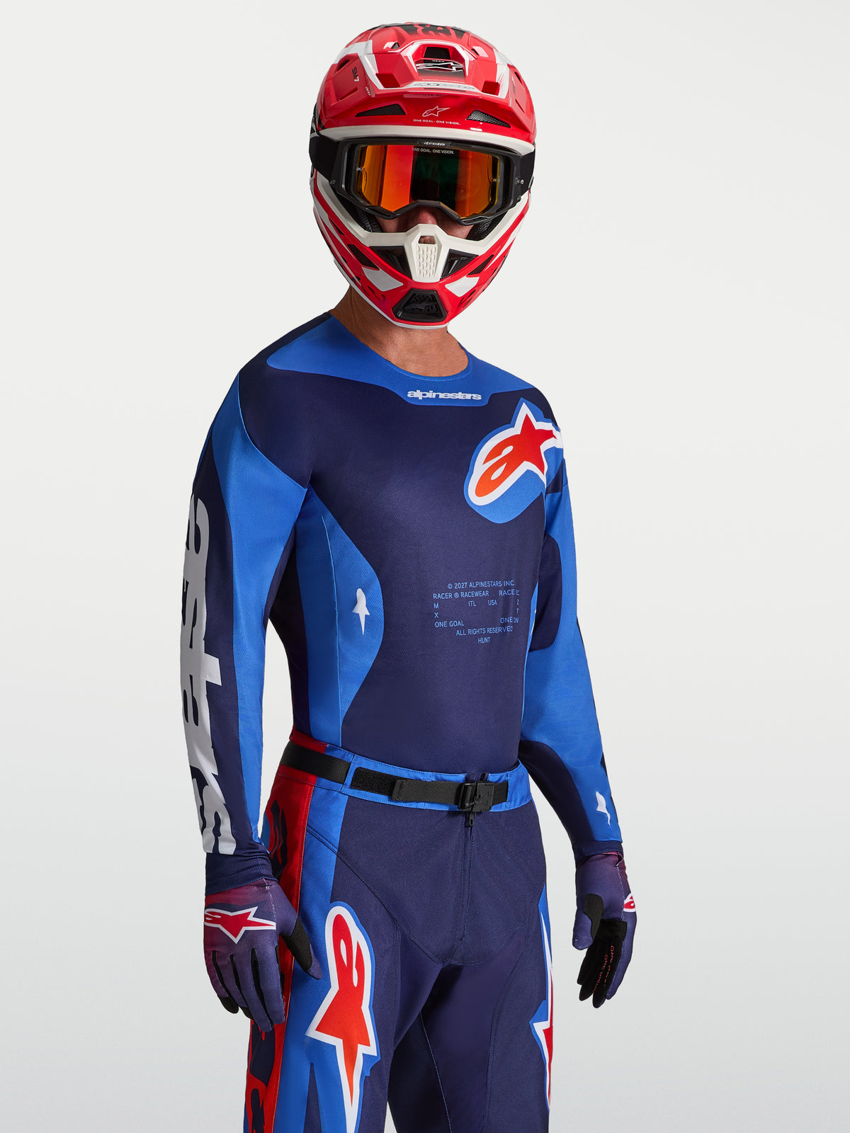 Alpinestars Racer Hunt Jersey in Strong Blue and Fire Red, motocross jersey with moisture-wicking fabric on model.