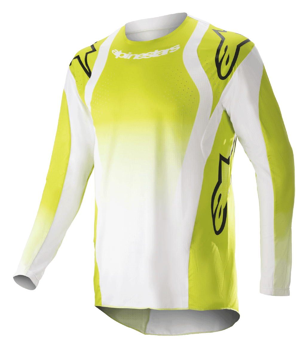 Alpinestars 2023 Techstar Push Jersey, langærmet motocross-trøje, gul fluo og hvid, med store sorte Astars-logoer på skuldre og ærmer, perforeret performance-stof, rund halsudskæring og forlænget rygstykke til off-road racing
